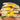 Everything bagel sandwich with egg, greens, and whipped cheese.